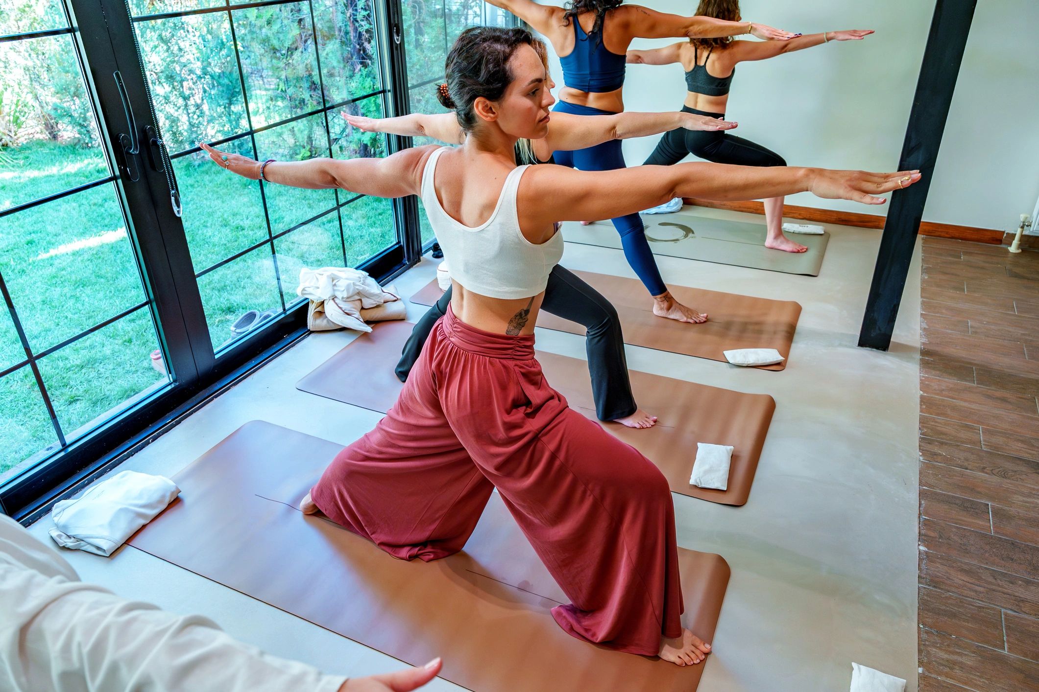 Group yoga session in a warm studio
